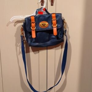 Fossil navy leather satchel with brown leather detail and gold hardware.